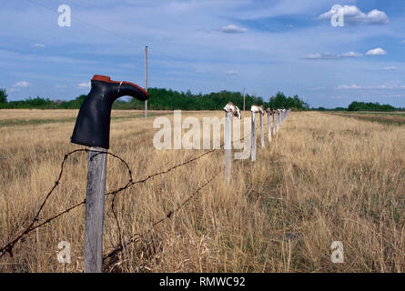 Boot come palo da recinzione caps,Saskatchewan, Canada Foto Stock