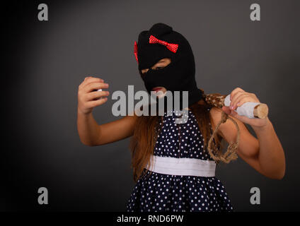 Thug baton girl Foto Stock