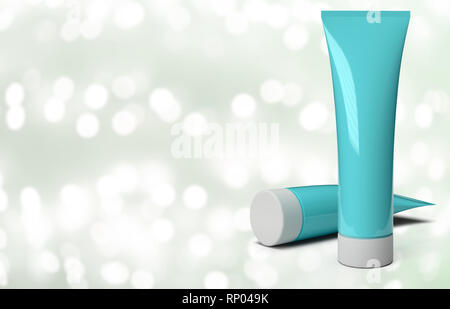 Tubi di crema su un sfondo astratto con luci sfocate Foto Stock