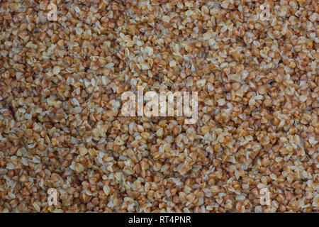 Il grano saraceno. Background e texture di grano saraceno. Bollito di grano saraceno. grano saraceno grits bollito. Foto Stock