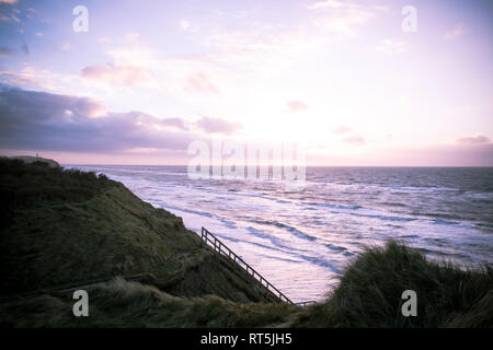 La Danimarca, a nord dello Jutland, Lonstrup, vista da dune a orizzonte al crepuscolo Foto Stock
