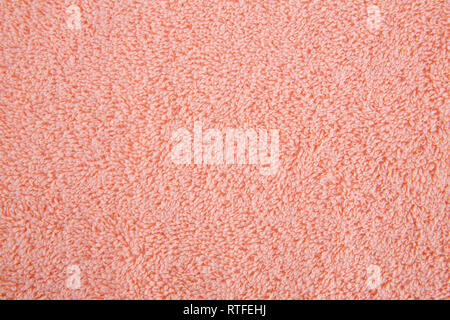 Peach colore texture asciugamano come sfondo, primo piano immagine. Foto Stock