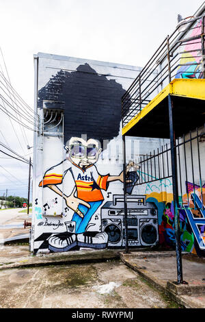 Graffiti di un uomo con un afro da uno stereo, creato da alcuni artisti di talento nel centro cittadino di Houston, TX Foto Stock