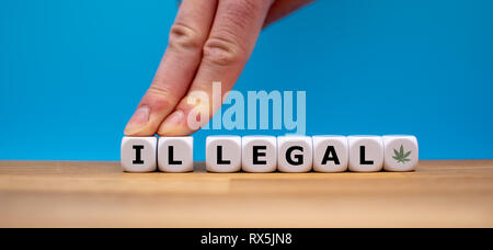 Simbolo per la legalizzazione della marijuana. Dadi forma la parola "illegale" mentre due dita spingere le lettere 'IL' lontano al fine di modificare la parola "legale".