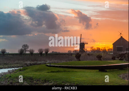 Molen Uitwijkse al tramonto Foto Stock