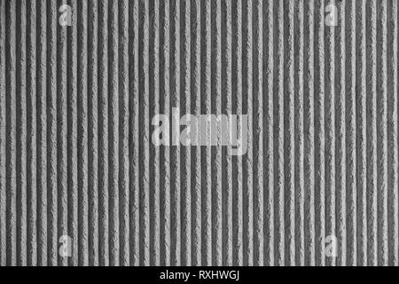 La superficie della parete con una decorazione in gesso bianco. Textured parete in calcestruzzo con linee verticali e strisce come una texture o dello sfondo. Riparare, design Foto Stock