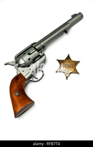 Colt.45 azione unica pistola e sheriff badge Foto Stock