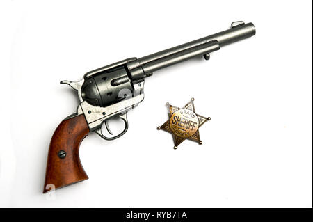 Colt.45 azione unica pistola e sheriff badge Foto Stock