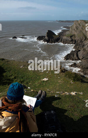 Pittura ragazza vista sulle scogliere sul mare a Worms testa dal Knave su Gower Foto Stock