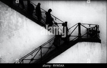 Persone su scale Foto Stock