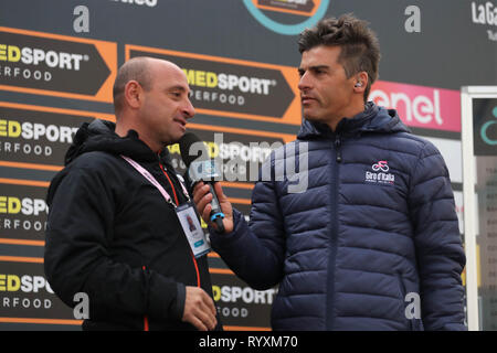 Foligno, Italia. Xv Mar, 2019. Paolo Bettini durante il 3eme etape Pomarance - Foligno Tirreno - Adriatico foto - Laurent Lairys /MAXPPP Credito: Laurent Lairys/Agence Locevaphotos/Alamy Live News Foto Stock