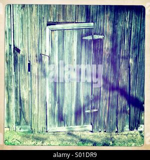 Weathered porta del granaio. Foto Stock