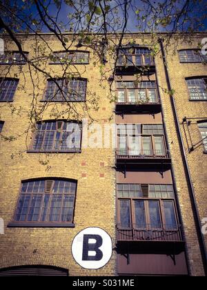 Victorian London docklands warehouse, ora appartamenti Foto Stock