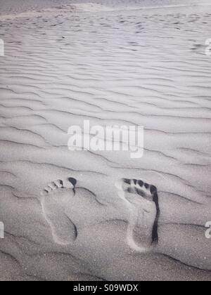 I piedi nella sabbia Foto Stock