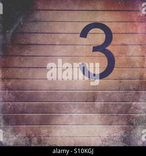 Il numero 3 su un sfondo grungy Foto Stock