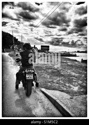Fotografo in una motocicletta. Foto Stock