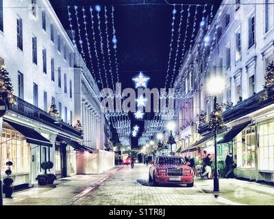 Le luci di Natale in Motcomb Street Knightsbridge di Londra Foto Stock