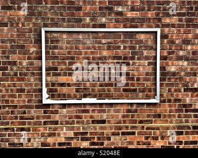 Un telaio su un muro di mattoni Foto Stock