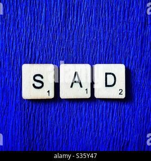 Piastrelle di legno incantesimo fuori triste. Foto Stock