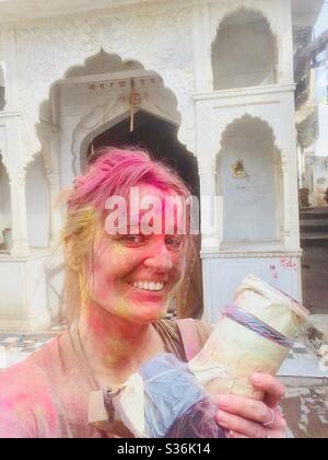 Fotografo al festival Holi in India Foto Stock