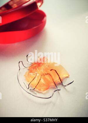 Still Life of a retainer dental appliance and its case on a residential sink, USA Foto Stock