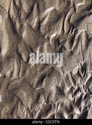 Texture su bagnata sabbia idea come sfondo Foto Stock