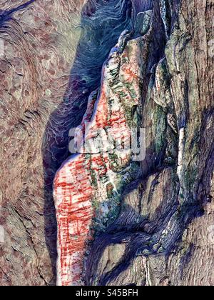 Interessanti coloratissimi colori di roccia sedimentaria e motivi venosi sulla spiaggia rocciosa di Seaton, Cornovaglia, Inghilterra Foto Stock