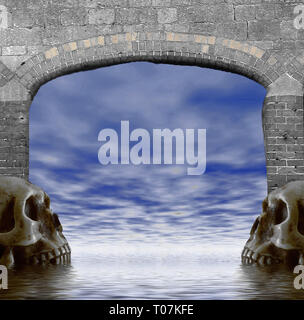 Un ingresso ad arco con scary skull testine su entrambi i lati Foto Stock