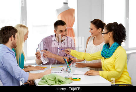 team of fashion designers working at office Foto Stock