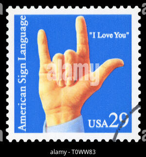 Stati Uniti d'America, circa 1993: una fase di affrancatura postale timbro stampato negli Stati Uniti mostra un'immagine di una mano che "ti amo " segno di commemorazione Foto Stock