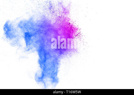 Bloccare il movimento della polvere colorata esplosioni isolati su sfondo bianco.colore delle particelle di polvere opener sullo sfondo Foto Stock