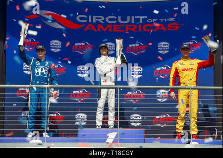 Austin, Texas, Stati Uniti d'America. 24 Mar, 2019. Colton Herta #88 prende la vittoria (Centro 1st) Josef Newgarden #02 (sinistra 2nd) e Ryan Hunter-Reay #28 (destra 3rd) celebrare vincendo in Indycar Classic, il circuito delle Americhe di Austin, Texas. Mario Cantu/CSM/Alamy Live News Foto Stock