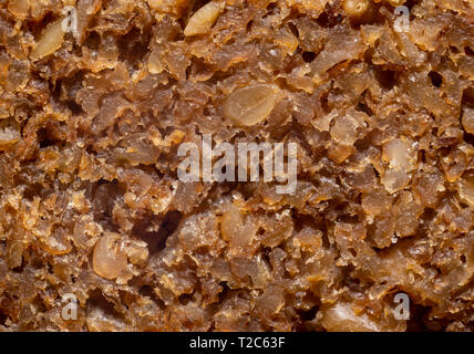 Macro estremo colpo di un insieme a fette di pane di grano con semi. Foto Stock