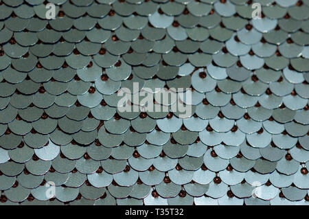 Background paillettes glitter sfondo con spie lampeggianti. Il tessuto di moda glitter, close up di paillettes in colori luminosi Foto Stock