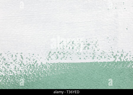 White pennellate su sfondo verde chiaro. alta texture dettagliate Foto Stock