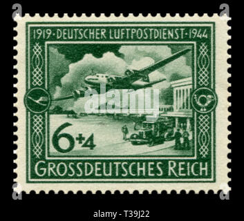 German Historical timbro: XXV anniversario della postale tedesco servizio dell'aria. Piano Focke-Wulf Fw 200 Condor in volo sopra l'aeroporto, posta aerea, 1944 Foto Stock