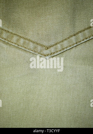 Il beige jeans denim tasca texture dettagliate di close-up. sfondo, tessuto. Foto Stock