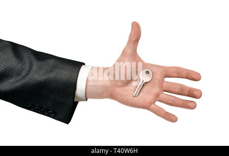 Close-up di mano d'uomo in tuta tenendo premuto un tasto isolati su sfondo bianco. Foto Stock