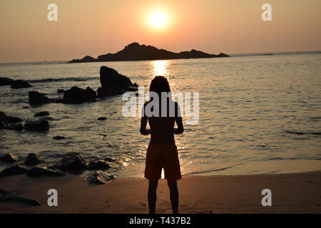 Tramonto sulla spiaggia Foto Stock