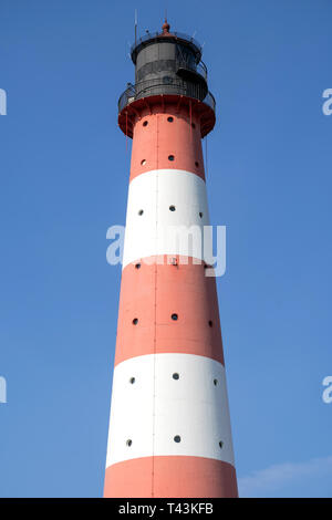 Faro di Westerheversand Schleswig-Holstein. Considerato uno dei più noti fari in Germania settentrionale, è stato costruito nel 1908. Foto Stock