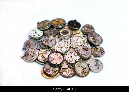Cherkassy, Ukraine - 27 March 2018. Details of clocks and mechanisms for repair, restoration and maintenance on a white background. Pocket watches det Foto Stock
