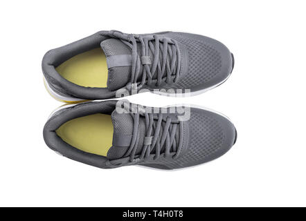 Coppia di sneakers su uno sfondo di legno. Foto Stock