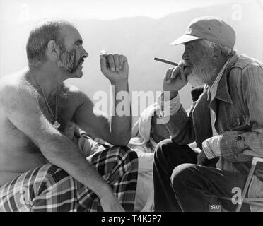 Sean Connery e il regista John Huston sul set candide filmare l'UOMO CHE SAREBBE STATO RE 1975 breve racconto di Rudyard Kipling Allied Artists Pictures / Devon Persky - Brillante / Columbia Pictures Foto Stock