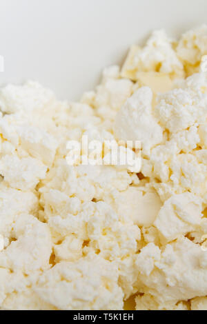 In un recipiente di miscelazione sono gli ingredienti burro e formaggio per rendere i cookie Foto Stock