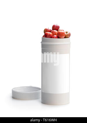 Scambiare le vostre pillole per una fresca mele rosse. Concetto di natura fatta integratore vitaminico da frutti naturali Foto Stock