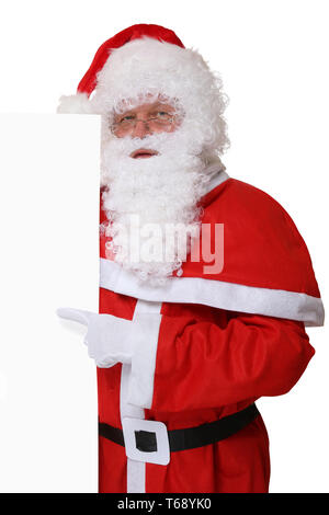 Nikolaus Weihnachtsmann zeigt un Weihnachten auf leeres Schild mit Textfreiraum Foto Stock