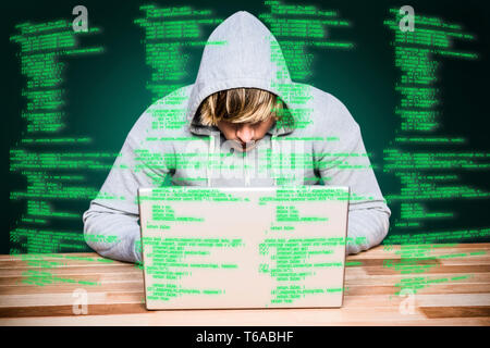 Immagine composita dell Uomo in camicia cappa hacking di un laptop Foto Stock