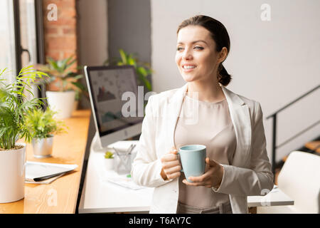Godendo della pausa caffè Foto Stock
