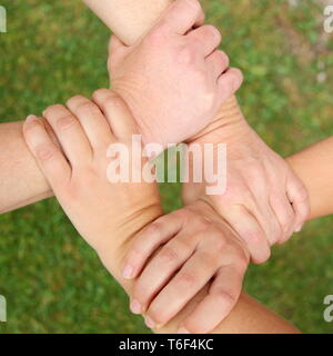 Collegato a quattro mani Foto Stock