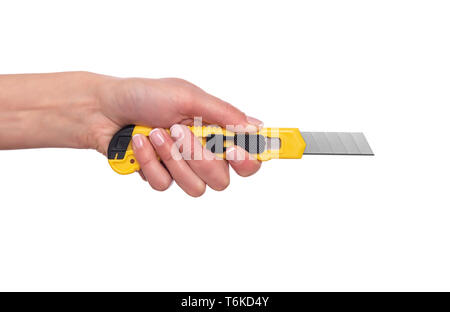 Articoli di cancelleria del coltello in una femmina di mano su sfondo bianco. Foto Stock